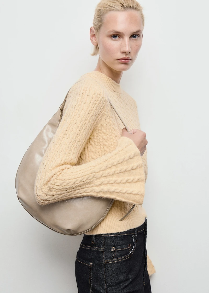 Cable-knit sweater with flared sleeves