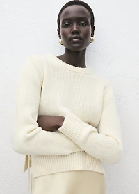 Knitted sweater with tie slits