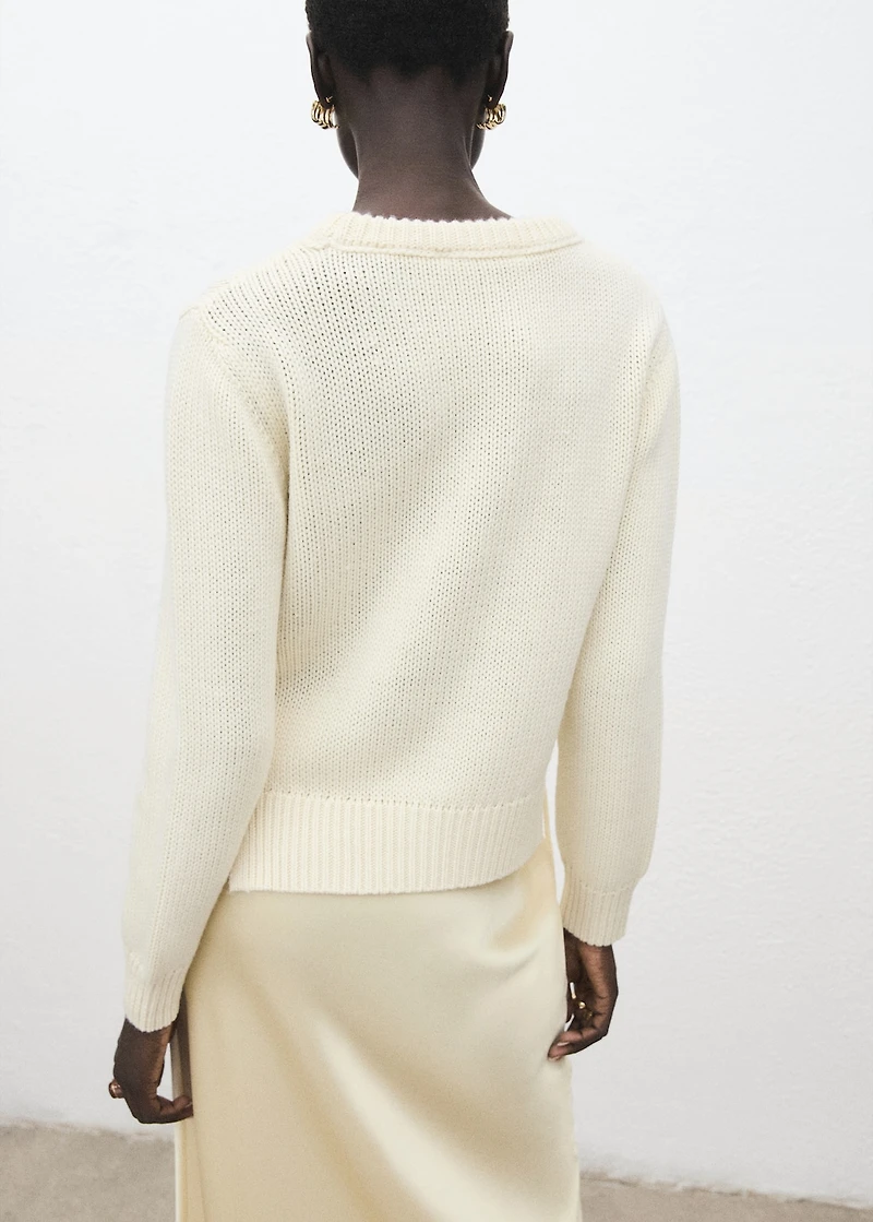 Knitted sweater with tie slits
