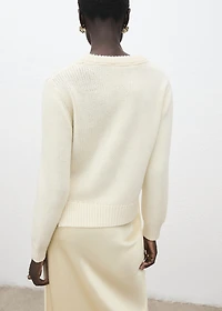 Knitted sweater with tie slits