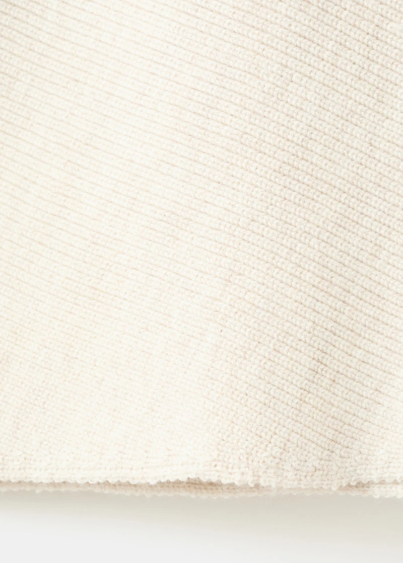 Sweater with asymmetrical neck and jewel buttons