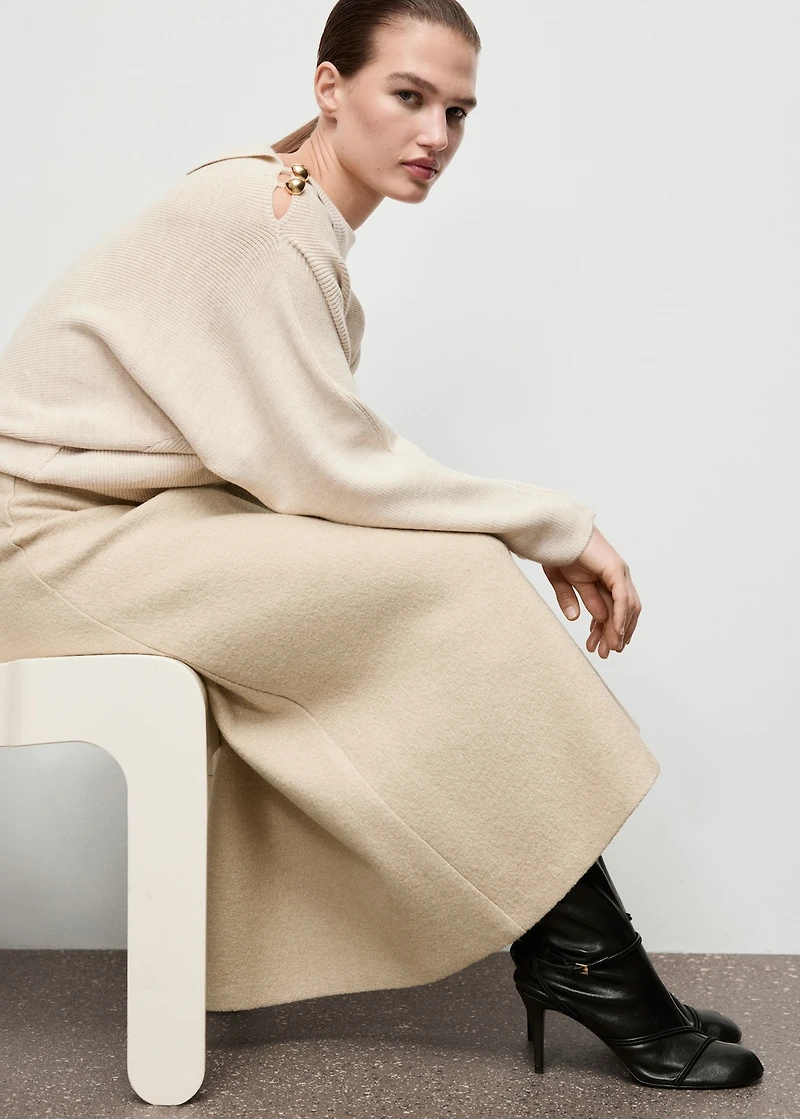 Sweater with asymmetrical neck and jewel buttons