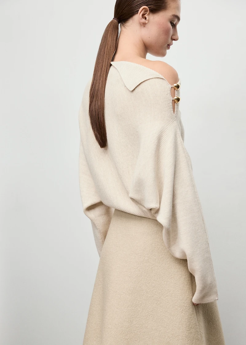 Sweater with asymmetrical neck and jewel buttons