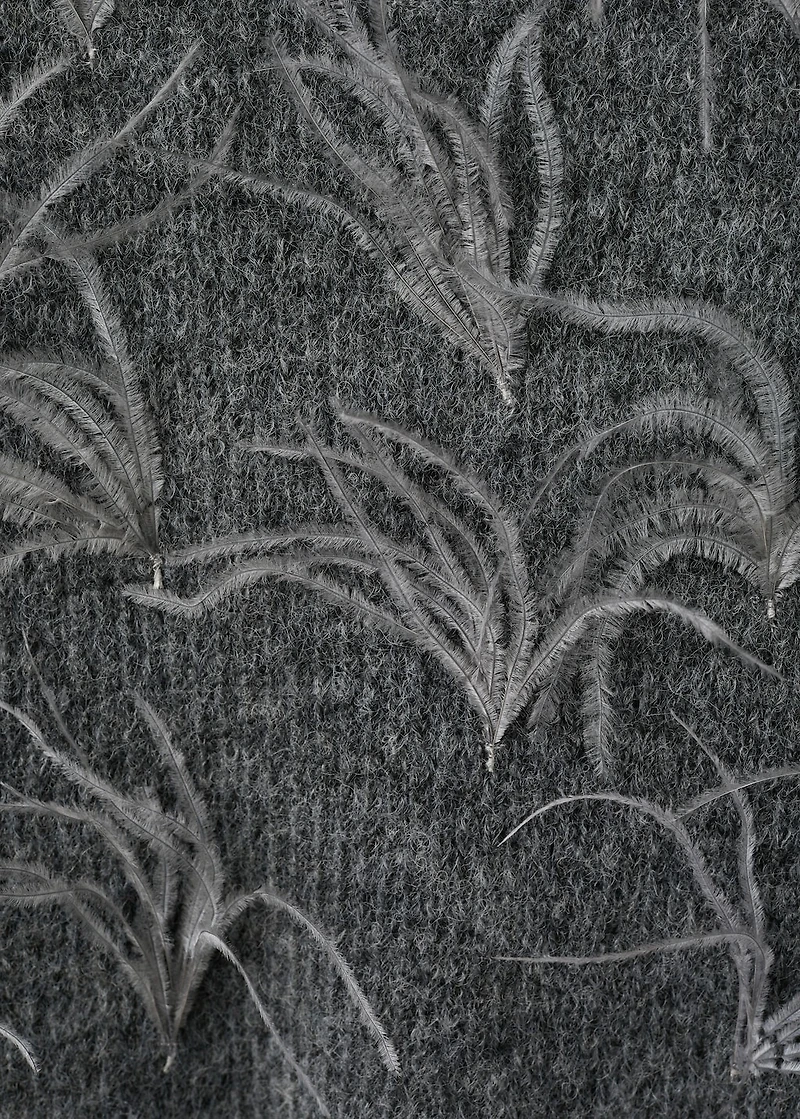 Knitted sweater with feathers