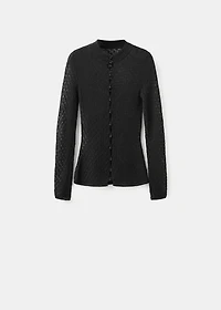 Openwork knitted sweater with bead fastening