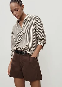 Denim shorts with frayed hem and pleats