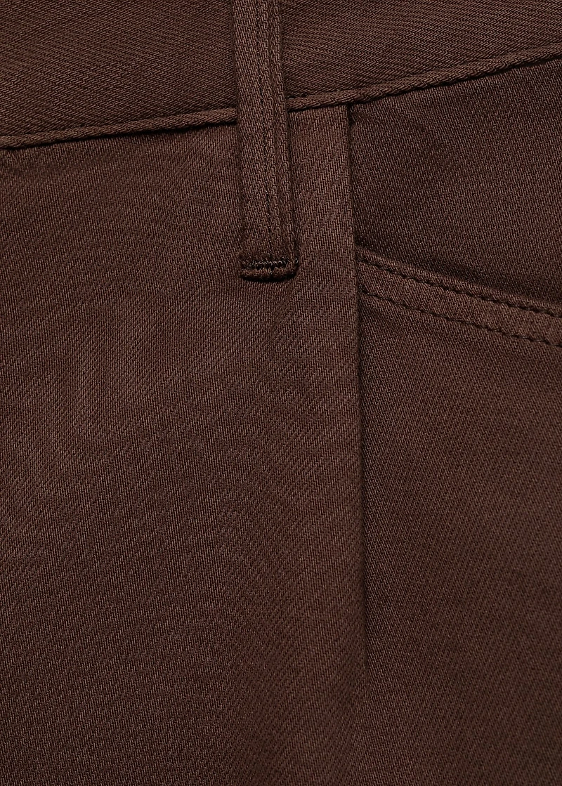 Denim shorts with frayed hem and pleats