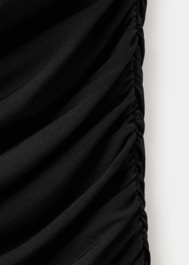 Ruched asymmetrical top with ruffle trim