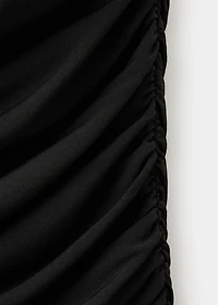 Ruched asymmetrical top with ruffle trim