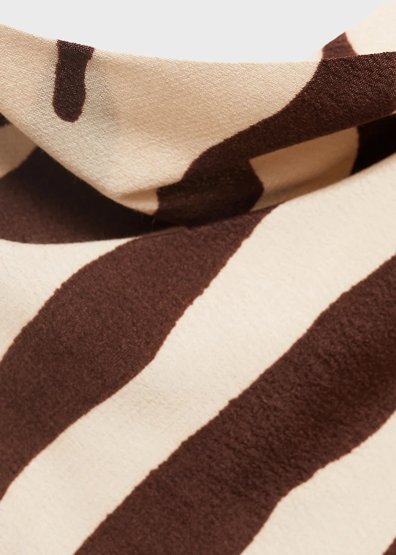 Zebra-print dress with draped neckline