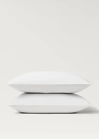 Two 500-thread count cotton percale pillowcases with rounded piping detail 60x60 cm