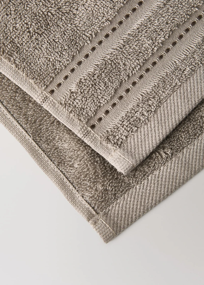 Cotton guest towel with embroidered dots