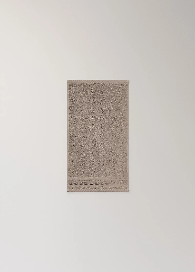 Cotton guest towel with embroidered dots