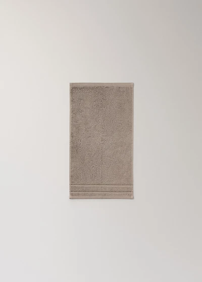 Cotton guest towel with embroidered dots