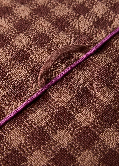 Cotton check-print bath towel with overlock stitching