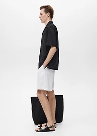 Shirt with embroidered eyelet details