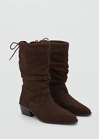 Knee-high leather boots with ruched detail