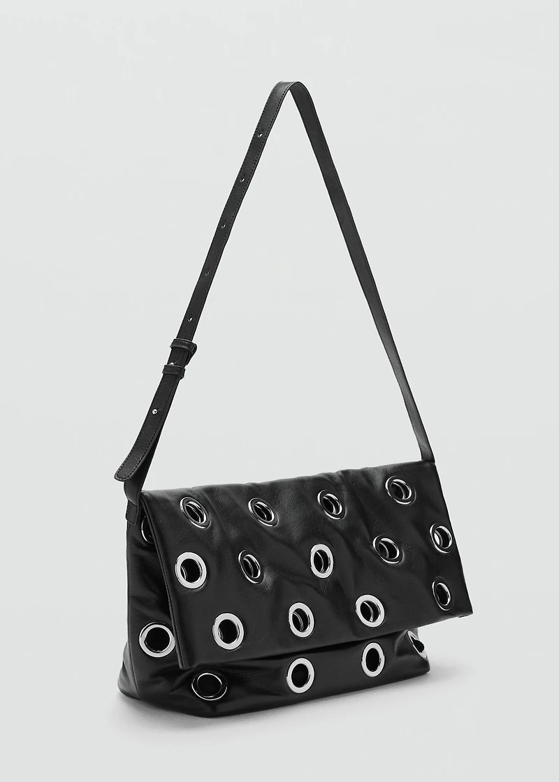 Crossbody bag with eyelets