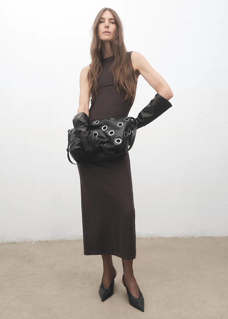 Crossbody bag with eyelets