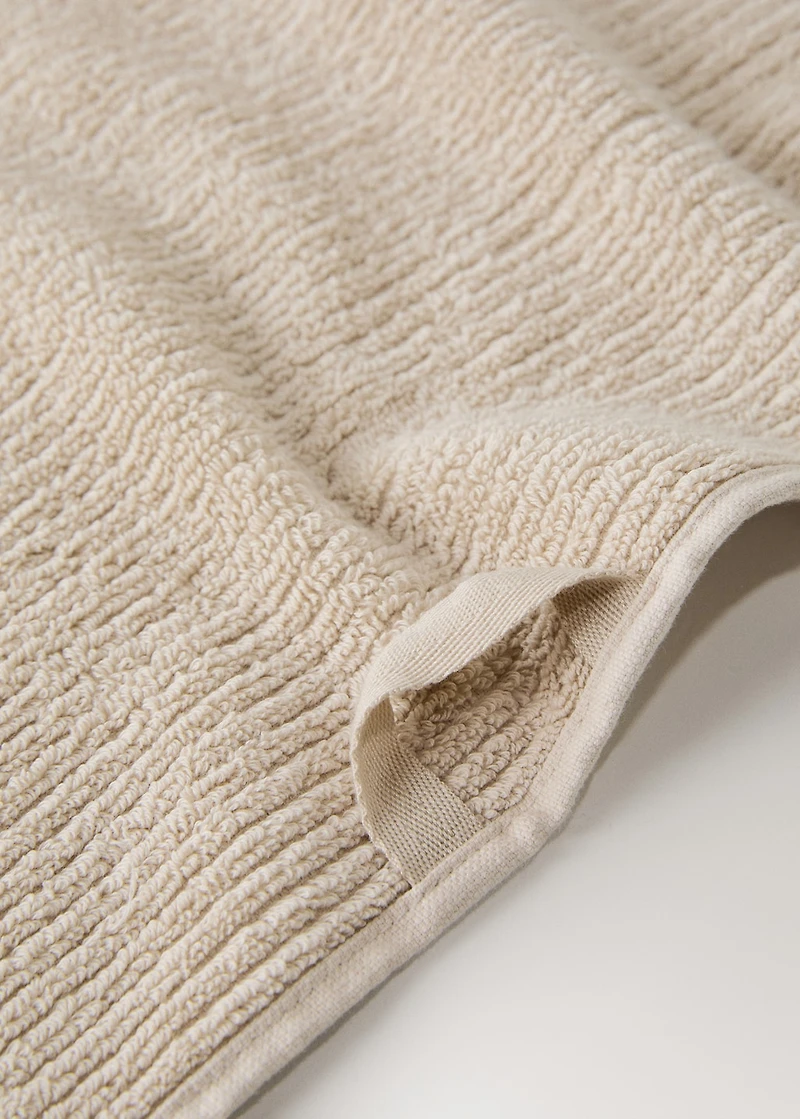 Textured guest towel with fringes