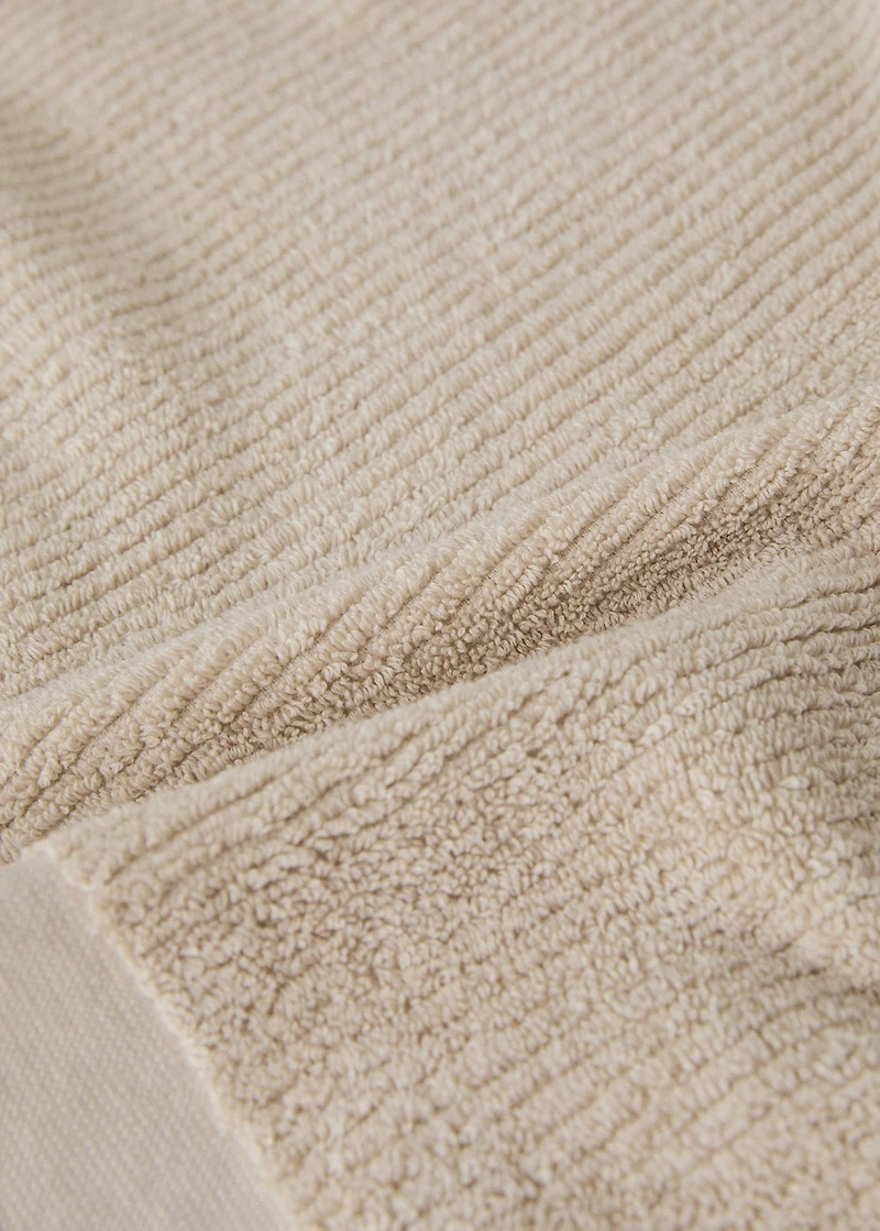 Textured guest towel with fringes