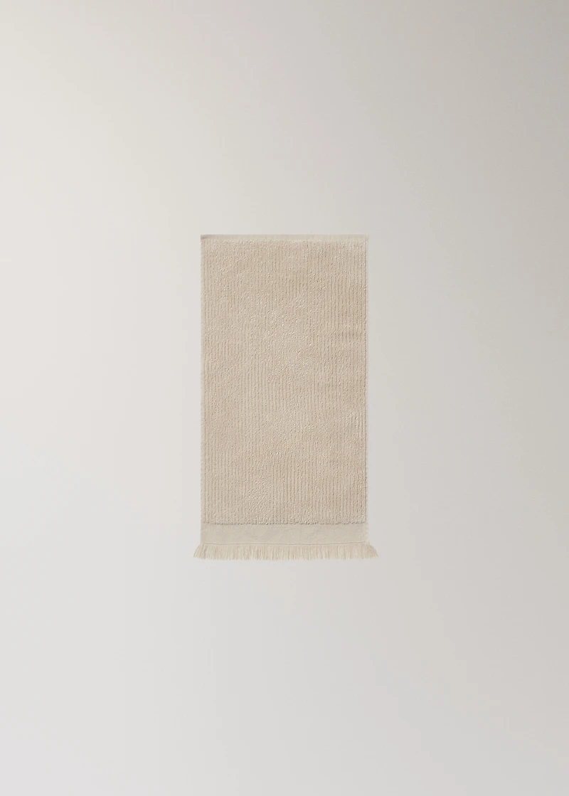 Textured guest towel with fringes