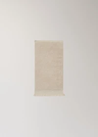 Textured guest towel with fringes