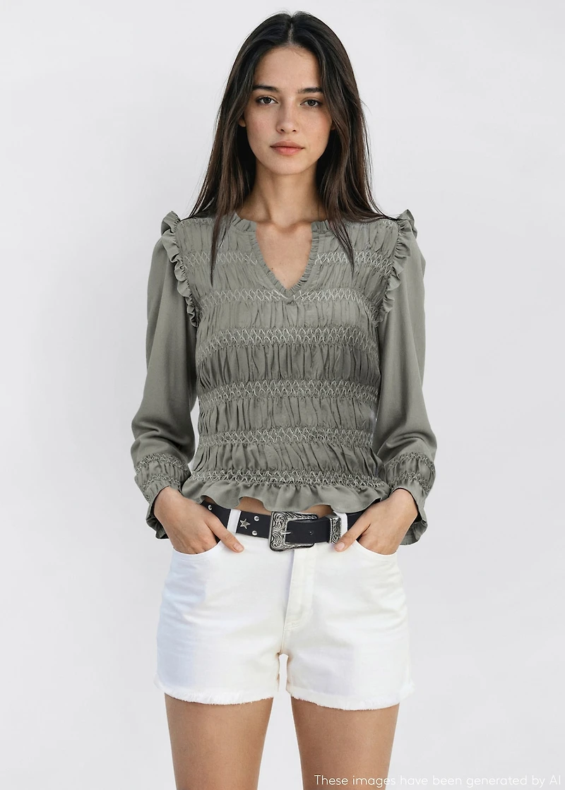Ruffled blouse with embroidered details