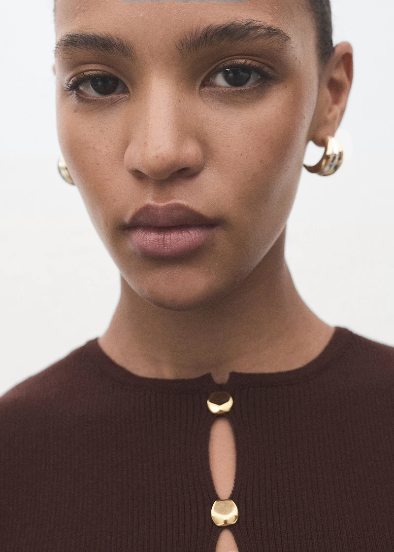 Knitted vest with slits