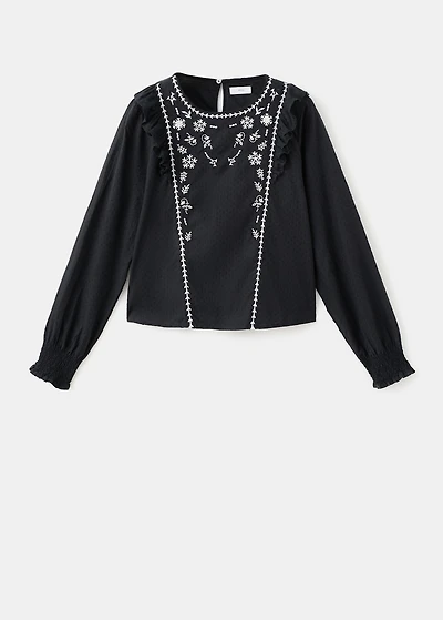 Ruffled embroidered blouse