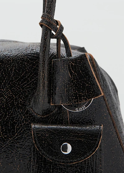 Leather shoulder bag with charms