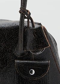 Leather shoulder bag with charms