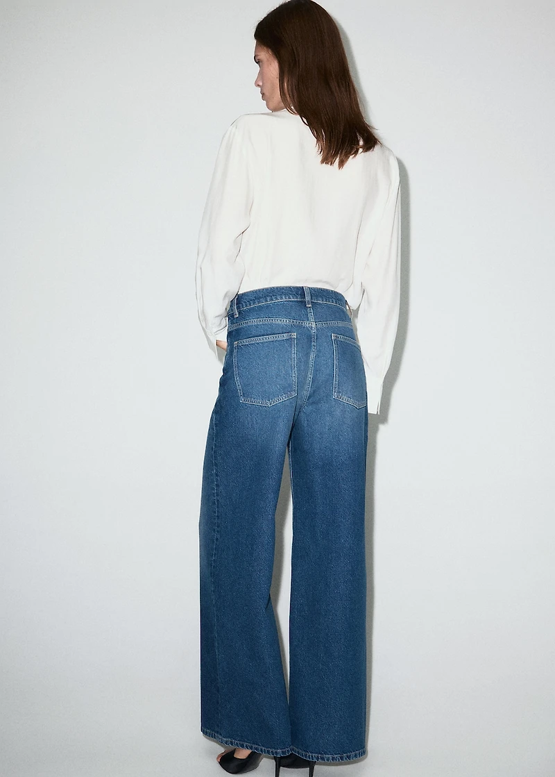 Wide-leg mid-rise jeans with a crossover waistband
