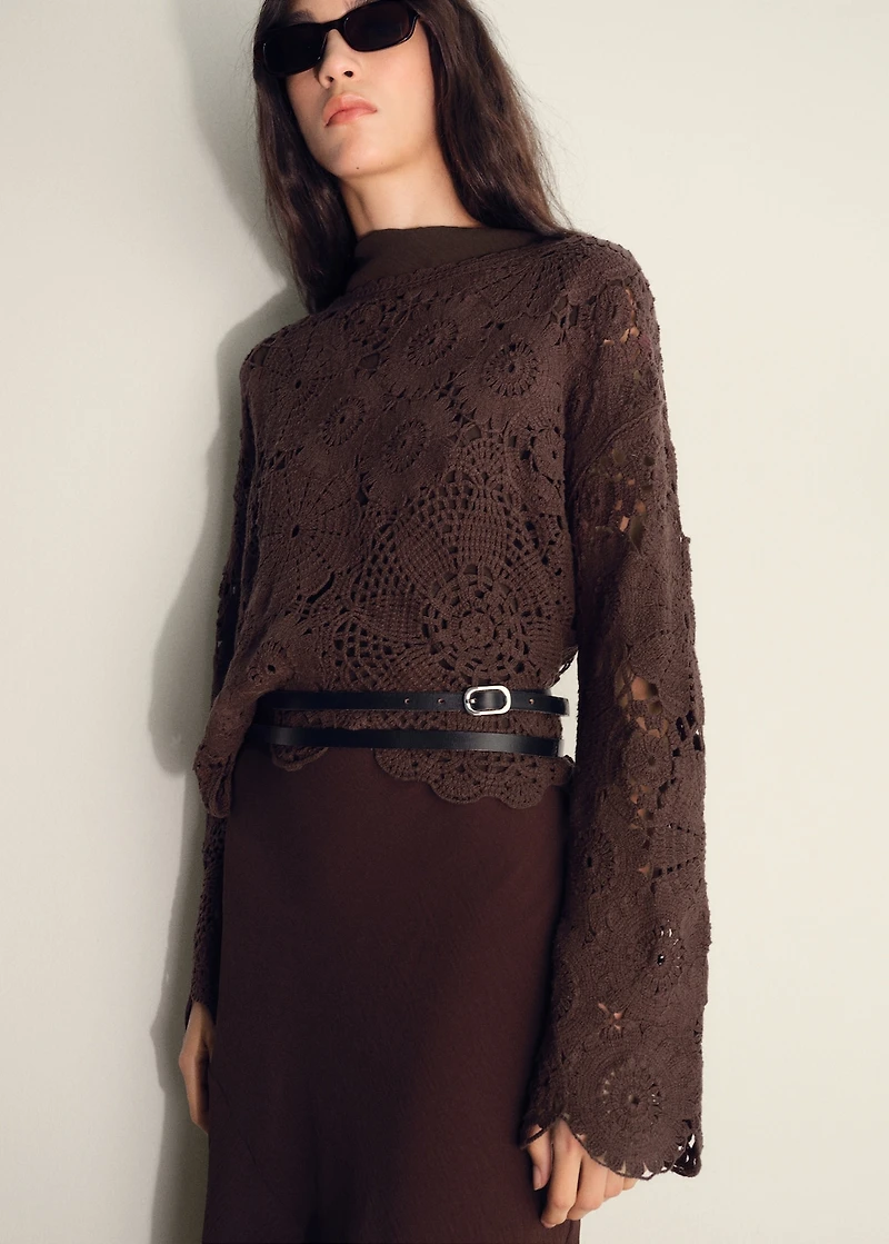 Crochet sweater with flowers