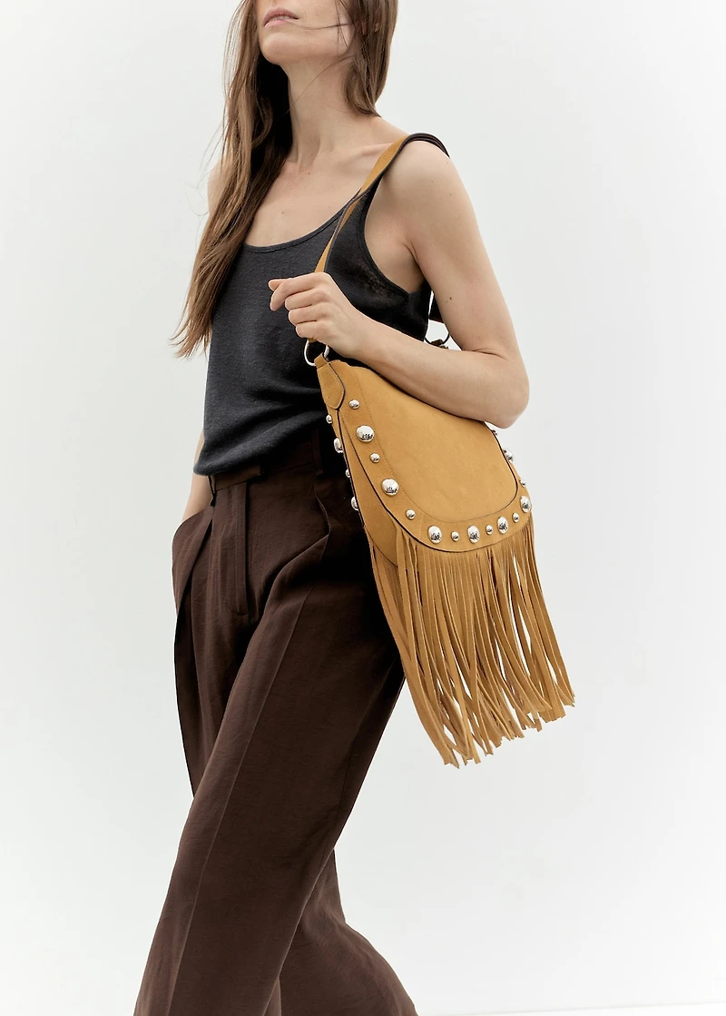 Suede bag with fringes and stud details