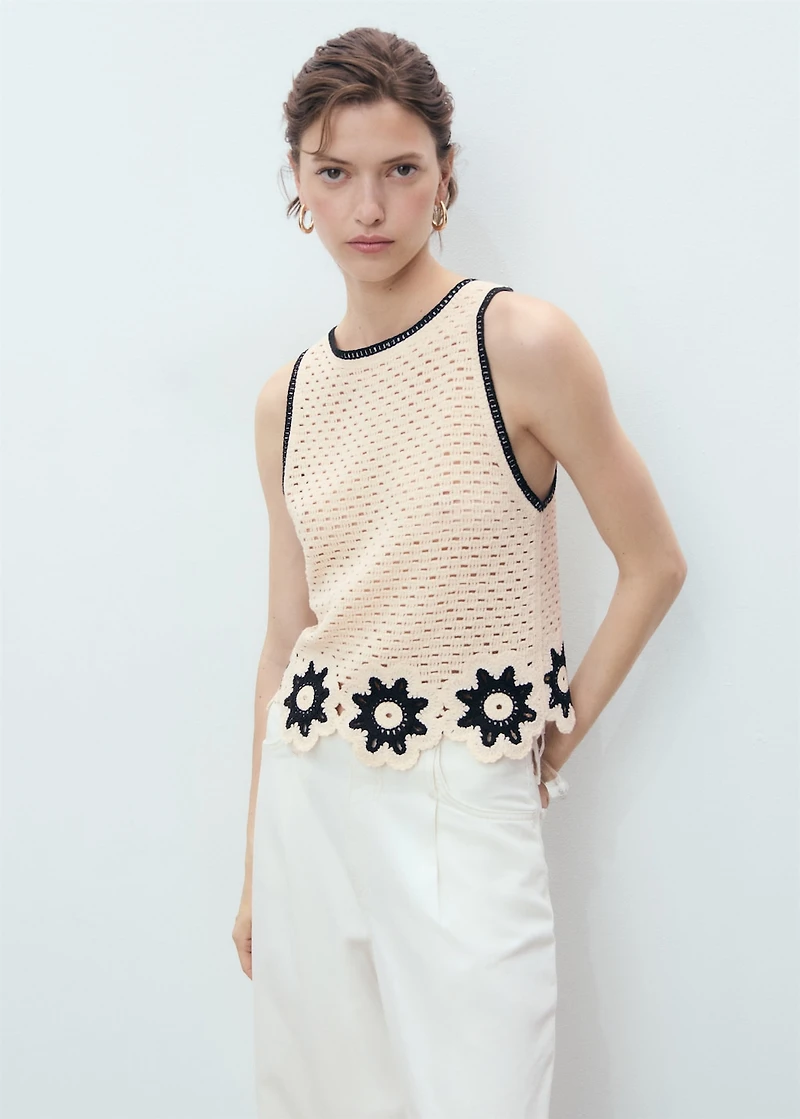 Crochet top with floral finishes