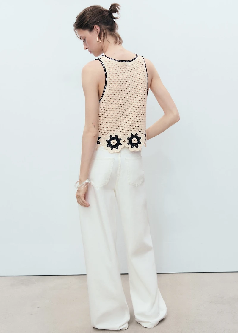 Crochet top with floral finishes