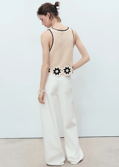 Crochet top with floral finishes