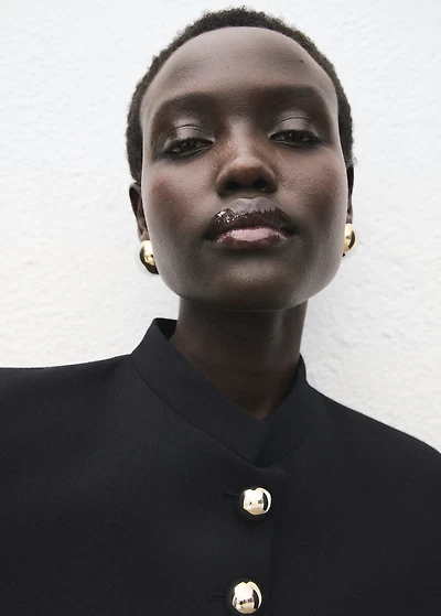 Jacket with jewel-button strip collar