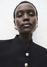 Jacket with jewel-button strip collar