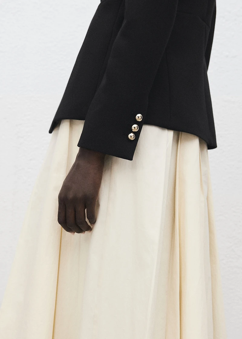 Jacket with jewel-button strip collar