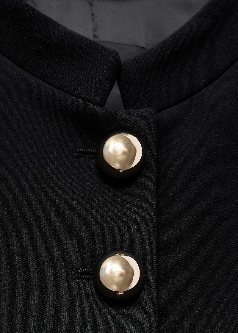 Jacket with jewel-button strip collar