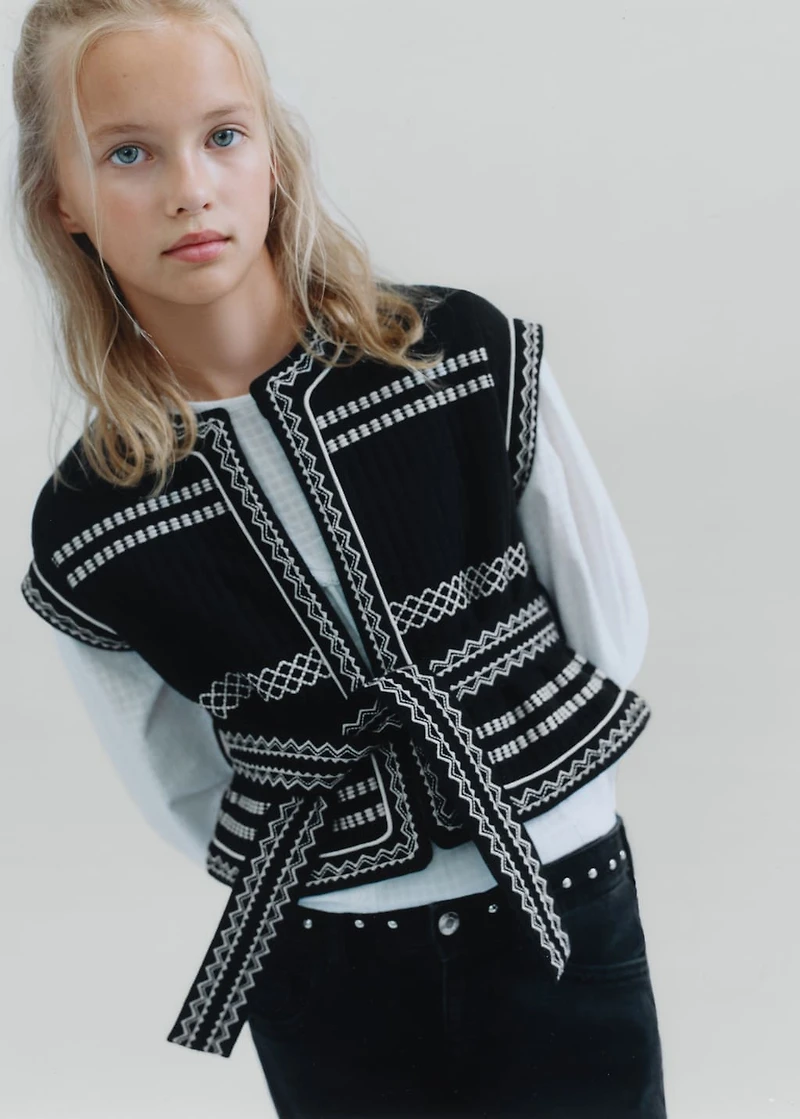 Embroidered vest with belt