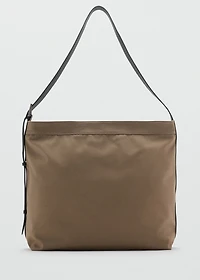 Shopper bag with adjustable handle