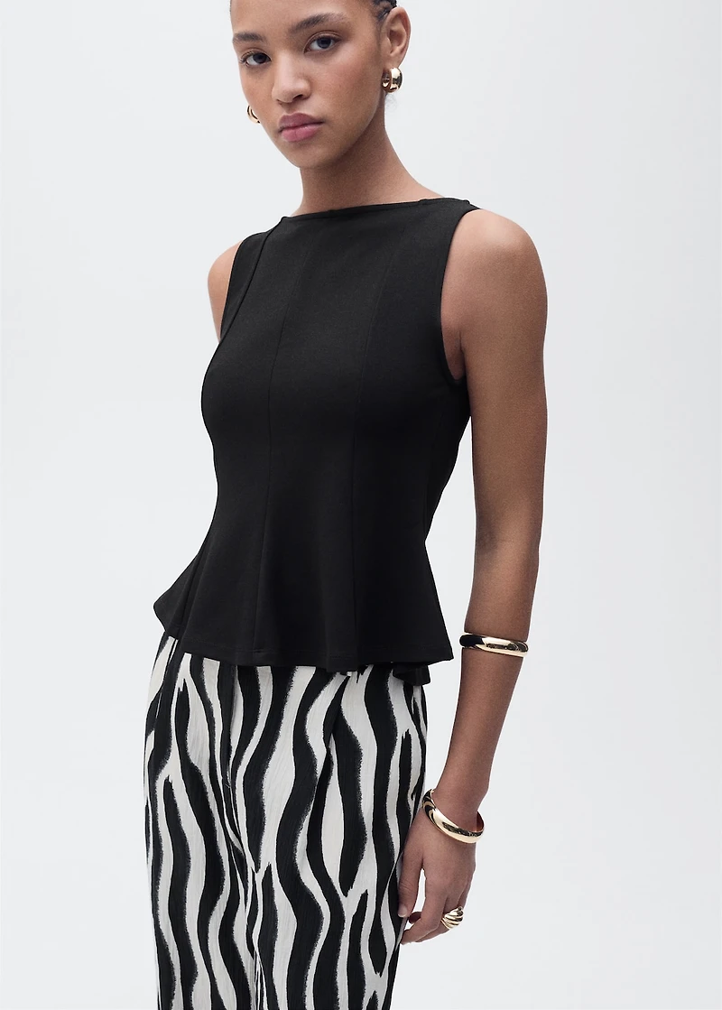 Peplum top with seam detail