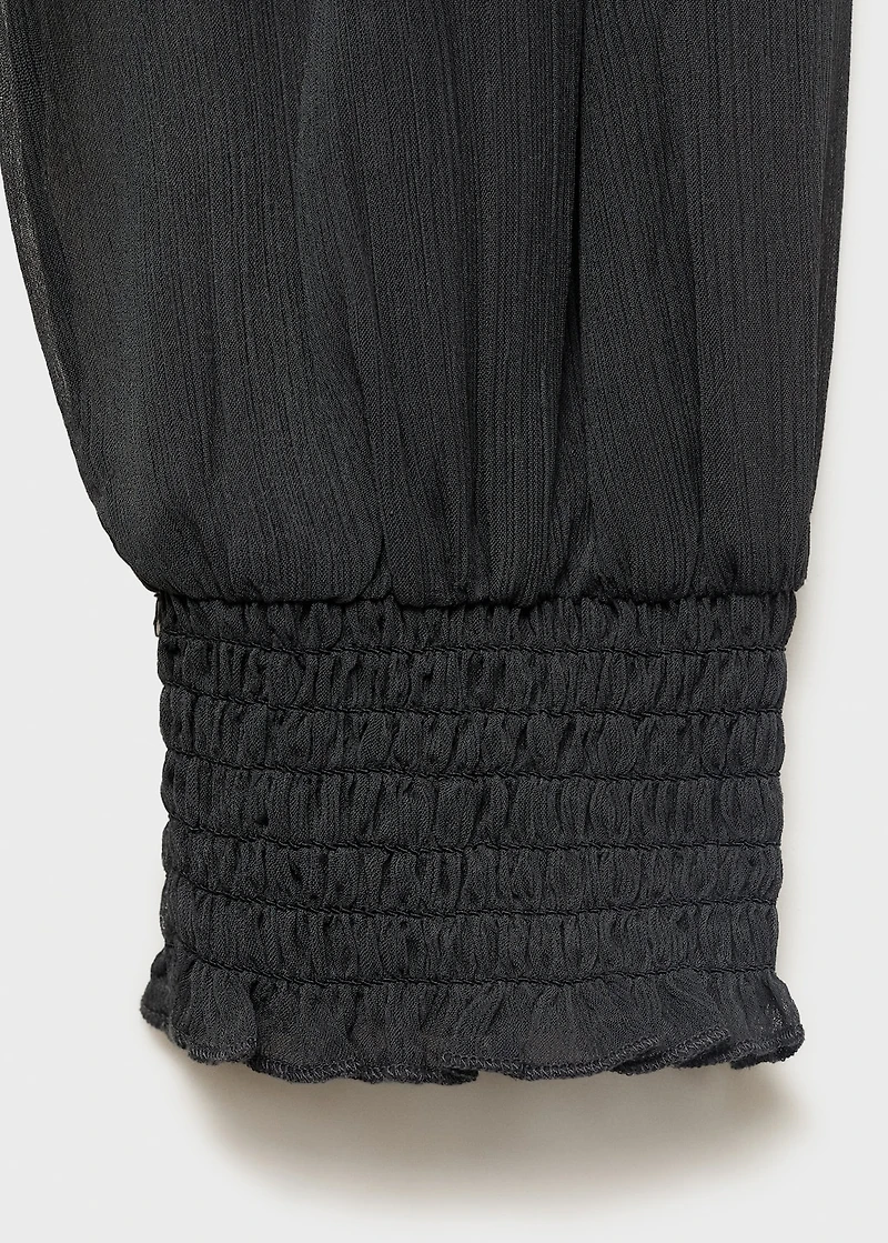Strapless blouse with ruffled panel