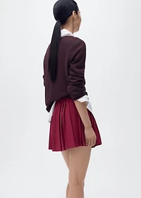 Pleated skirt with buckles