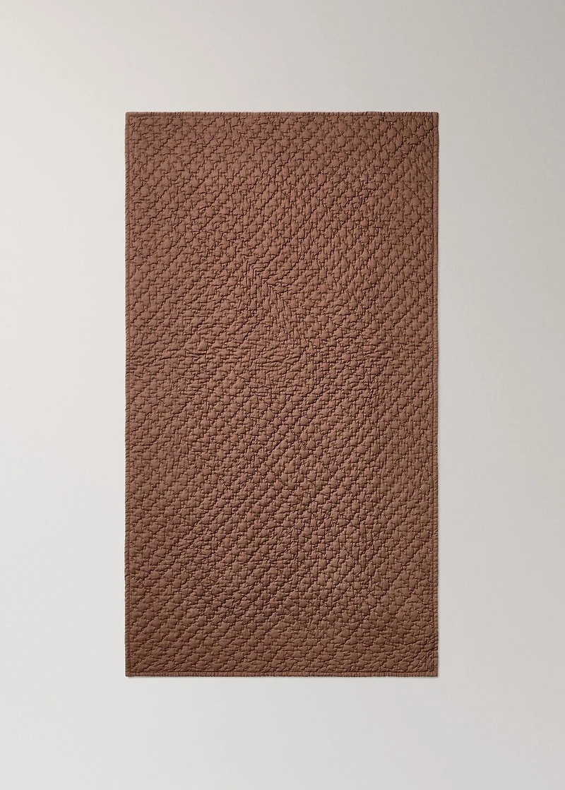 Hand-stitched cotton bedspread for mini-cot