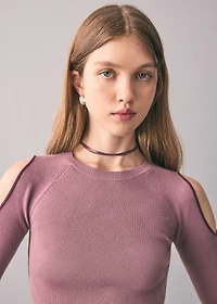 Knitted sweater with cut-out