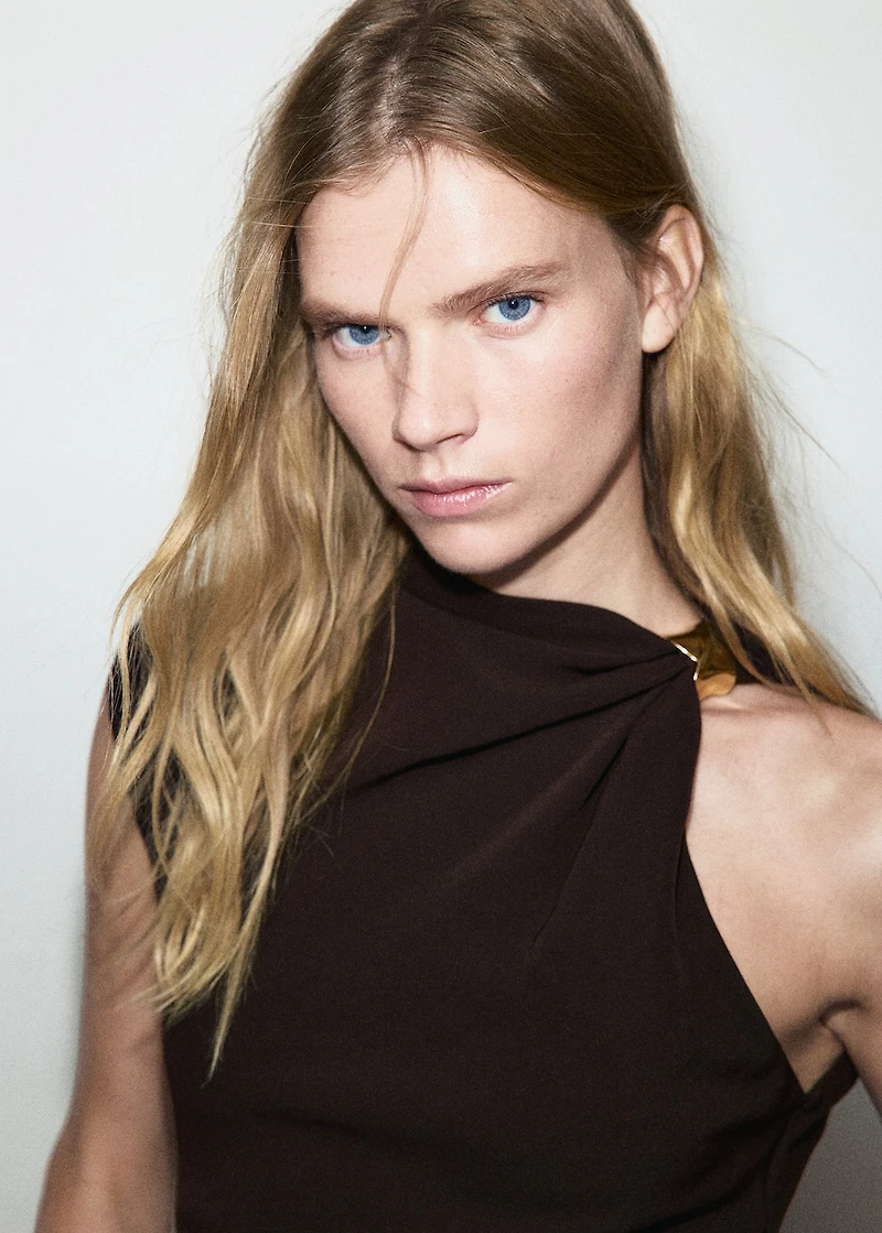 Dress with asymmetrical neck and metallic detail